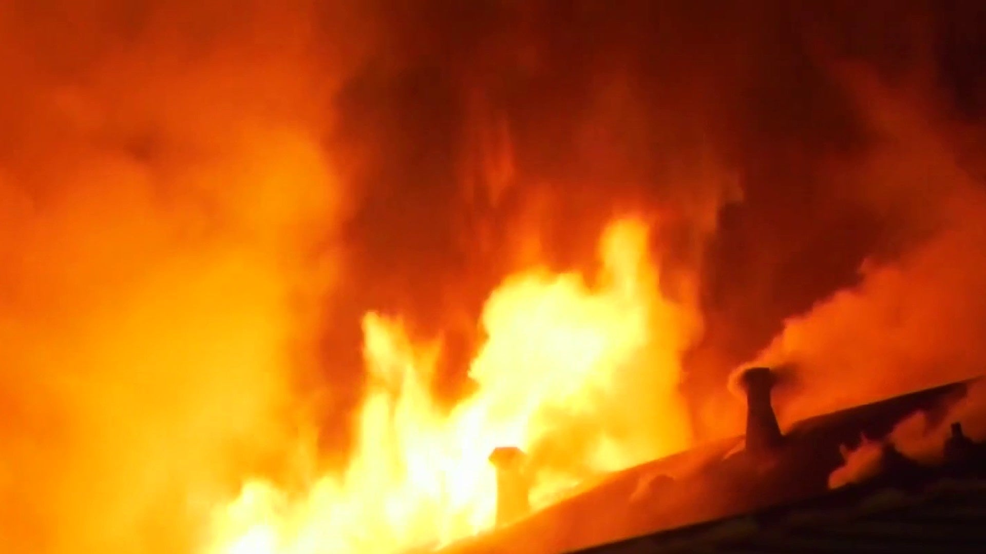 2 children dead, mother and grandfather injured after large apartment fire in Greenspoint