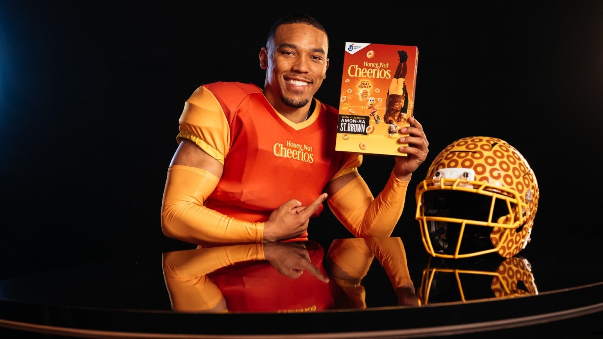 Detroit Lions' Amon-Ra St. Brown flips onto Honey Nut Cheerios box